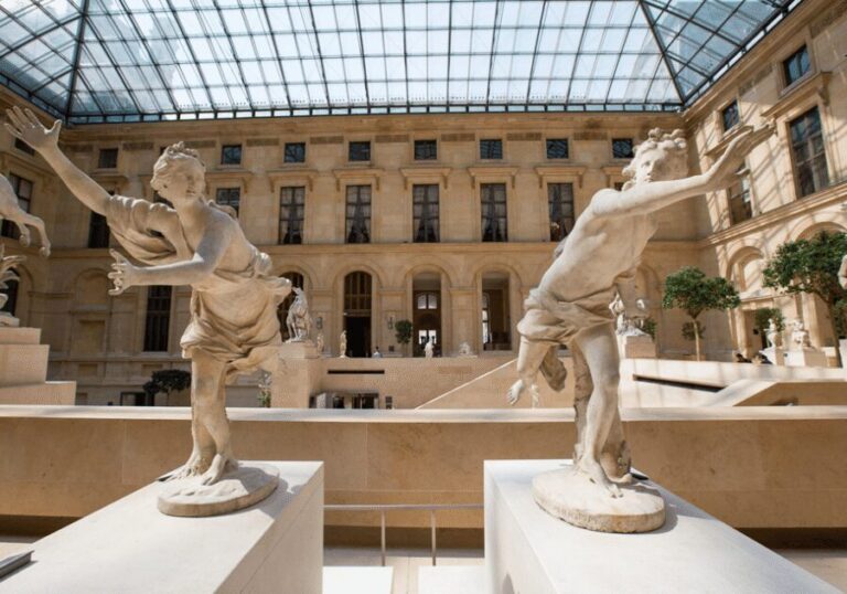 Paris: Louvre Museum Ticket & Exclusive Immersive AudioGuide - Entering the Louvre via the Pyramid with a ticketed queue